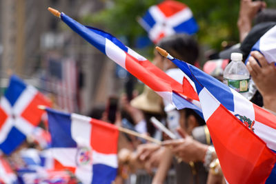 Dominican flags are seen at the dominican day parade along avenue of the americas in new york city.