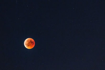 Idyllic shot of full moon against clear sky at night