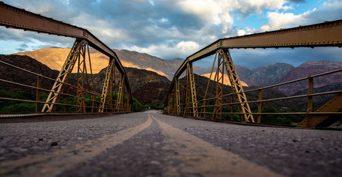 View of bridge against cloudy sky