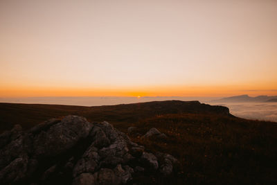 Scenic view of landscape against sky during sunset