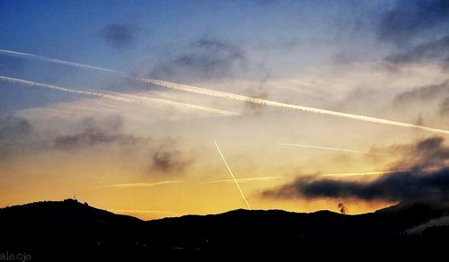 Low angle view of vapor trails in sky