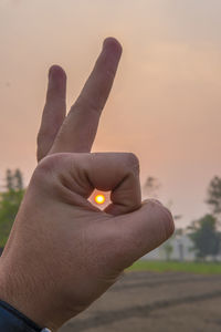 Sun seen through hand