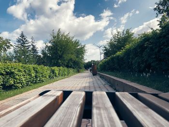 People walking on bridge against sky