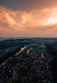 Aerial view of city at sunset