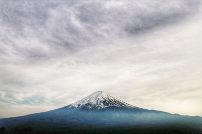 Mount fuji against cloudy sky 