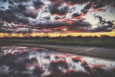 Scenic view of landscape against cloudy sky