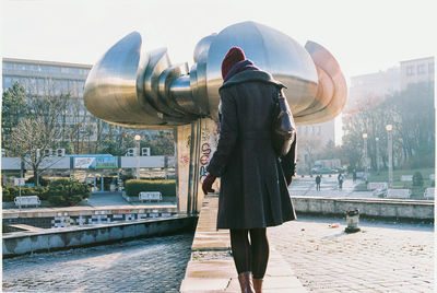 Midsection of man standing in city