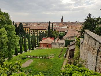 Houses and trees against sky garden above the city