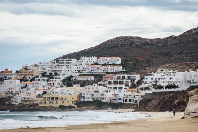 Town against cloudy sky