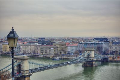 Suspension bridge over river in city