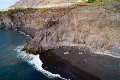 High angle view of rocks in sea