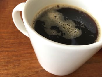 Close-up of coffee cup on table