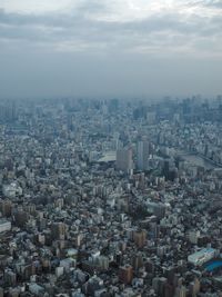 High angle view of buildings in city against sky