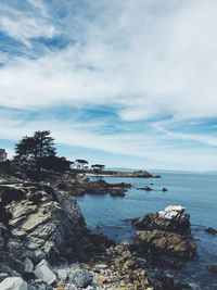 Scenic view of sea against cloudy sky