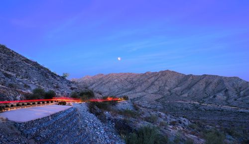 Scenic view of mountains against clear blue sky