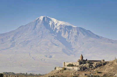 View of a building with mountain range in the background