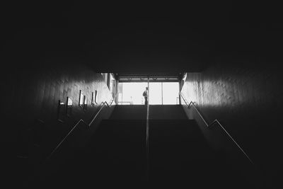 Low angle view of person standing on subway staircase