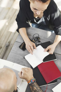 High angle view of architects working at table outdoors