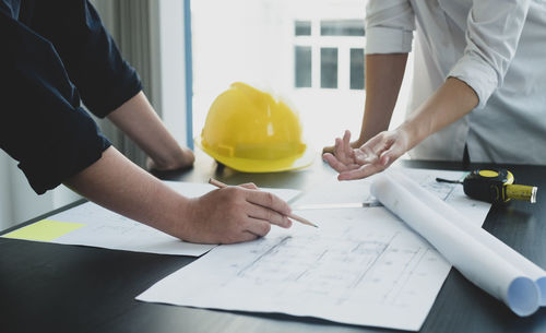 Midsection of man working at table