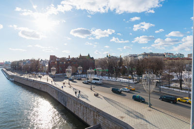 High angle view of river by city against sky