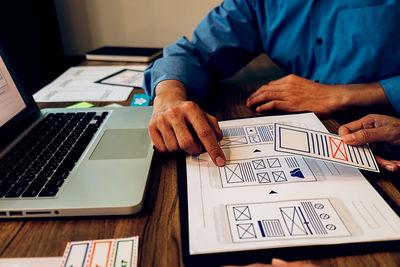 Low angle view of man working on table