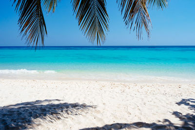 Scenic view of sea against clear blue sky