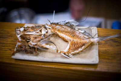 High angle view of fish in plate on table