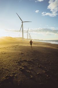 Man standing on field against sky