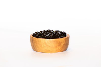 Close-up of black tea against white background