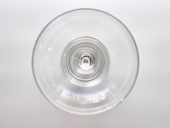 Directly below shot of glass table against white background