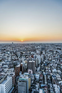 High angle view of buildings against sky during sunset