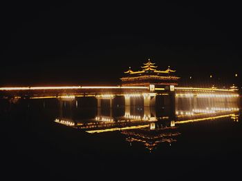 Reflection of illuminated lights in puddle