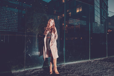 Full length of woman standing at night