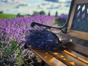 Lavender bouquet placed on a wooden bench