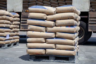 Cement bags are placed on pallets and stored in warehouses, cement bags for construction,