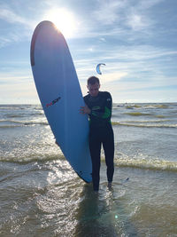 Full length of man on beach against sky