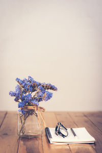 Close-up of vase on table against white background