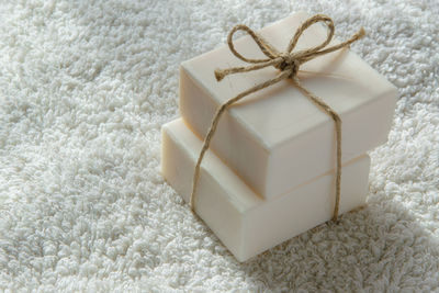 High angle view of soap bars on white towel