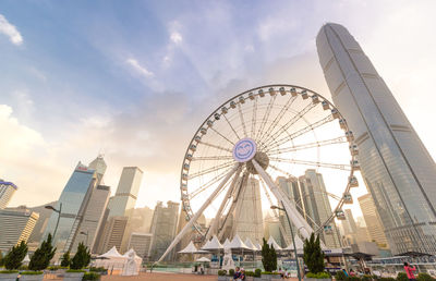 Ferris wheel in city against sky