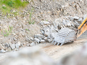 Detail of an excavator bucket. backhoe bucket digging. crawler excavator digging at shale layer.