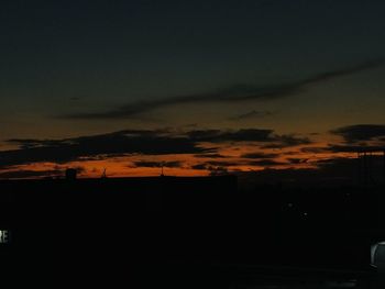 Scenic view of silhouette landscape against sky at sunset
