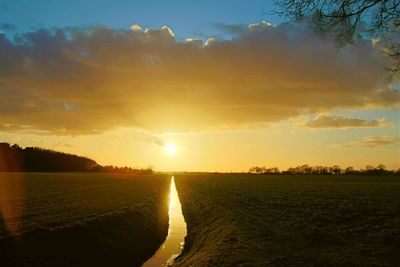 Scenic view of landscape at sunset