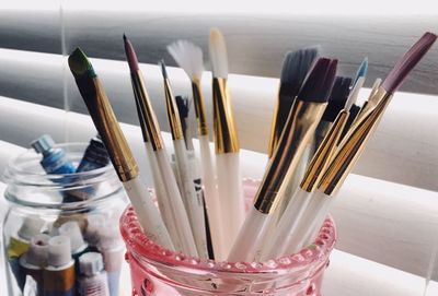 Close-up of paintbrushes in jar