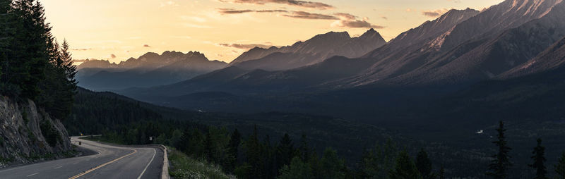 Scenic view of mountains against sky at sunset