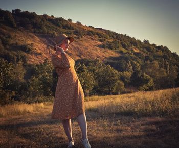 Full length of woman standing on field