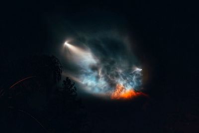 Low angle view of light against sky at night