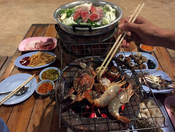 High angle view of people on barbecue grill