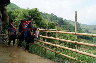 Full length of women looking at mountain