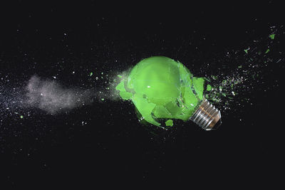 Digital composite image of illuminated light bulb