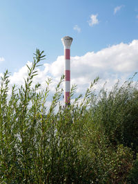 Low angle view of lighthouse against blue sky